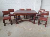 Table + 6 chairs Tudor style Belgium Oak/Leather 1920